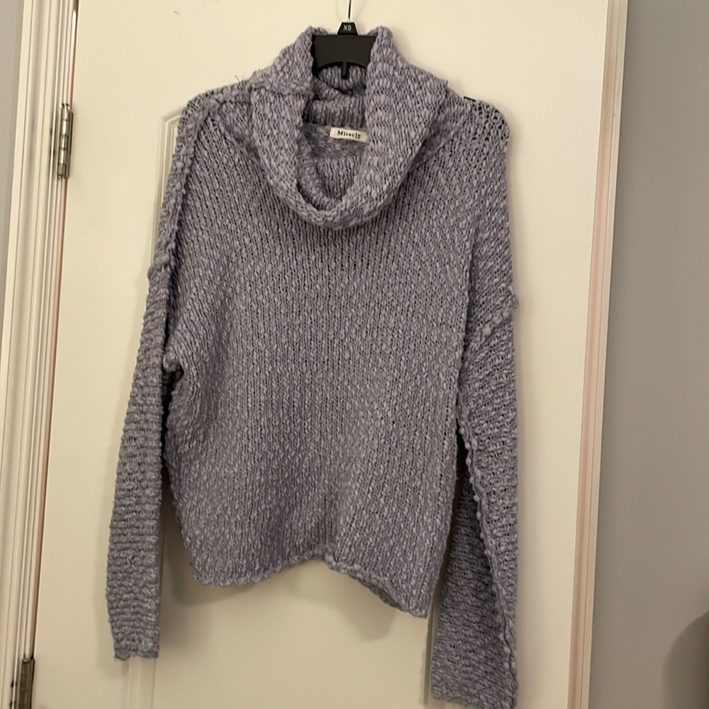purple knitted sweater